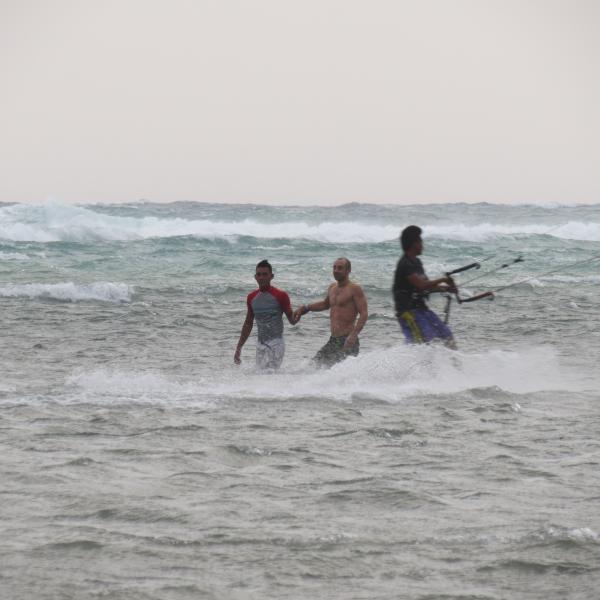 Happy to see kiteboarder, windsurfer and the swimmer safley back at Bulabog Beach.
