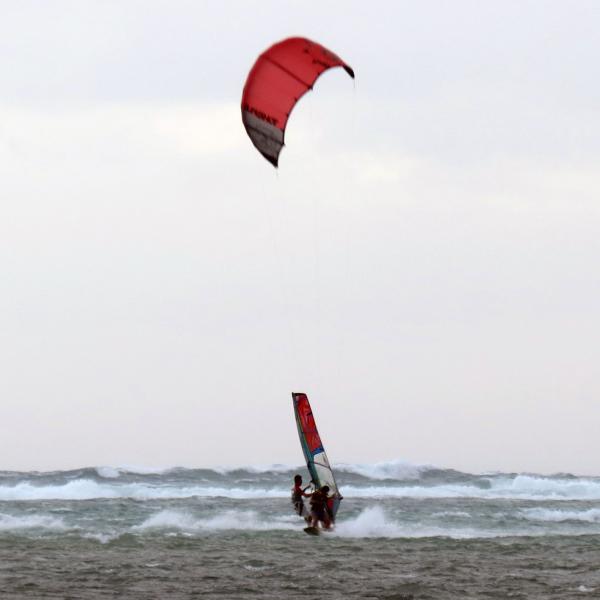 Kiteboarder Glynn and windsurfer Gordon rescue a New Year's swimmer at Bulabog Beach