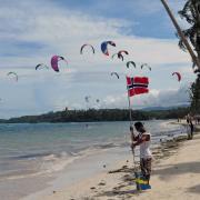  Kiteboarders are waiting at the starting line for the signal.