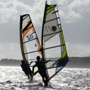 Sunrise windsurfing and kiteboarding at Bulabog Beach.